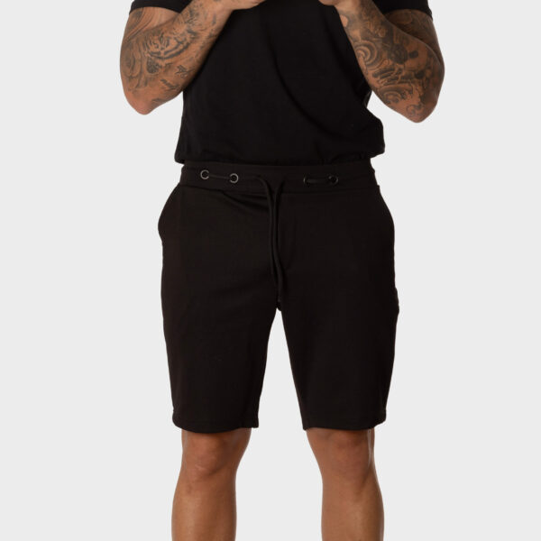 Bermuda Chándal Hombre Negra con Ojales Metálicos Pantalón Corto Deportivo